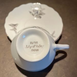 Five teacups and saucers.